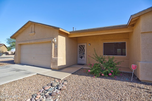 single story home featuring a garage