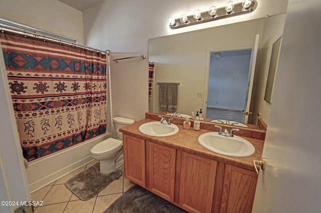 full bathroom featuring tile patterned floors, vanity, toilet, and shower / bath combo with shower curtain