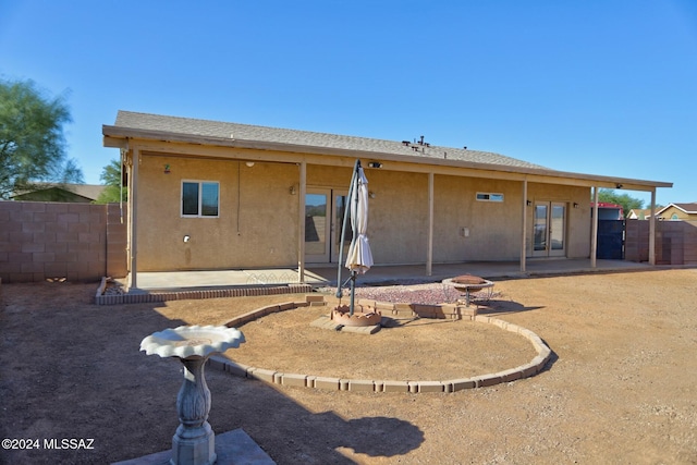 rear view of property featuring a patio