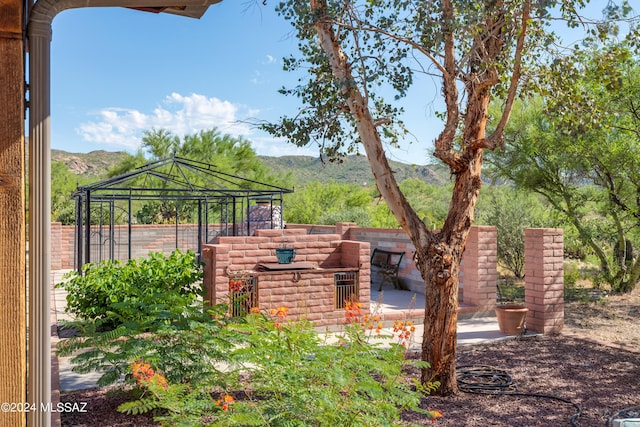 view of patio / terrace featuring a mountain view