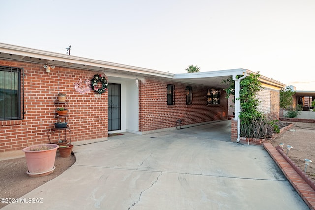 exterior space with a carport