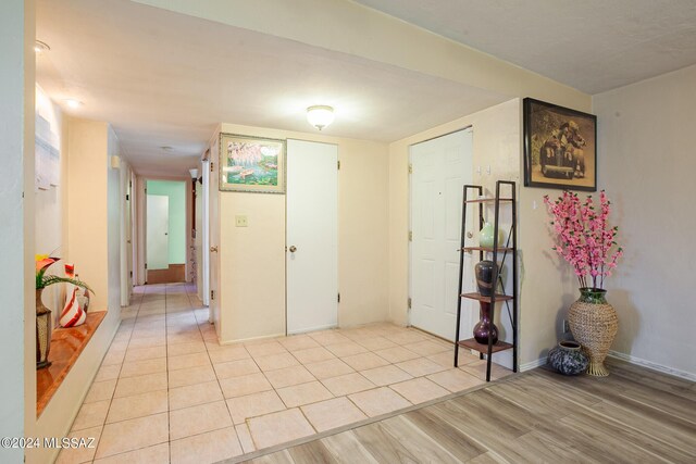 spare room featuring light tile patterned floors