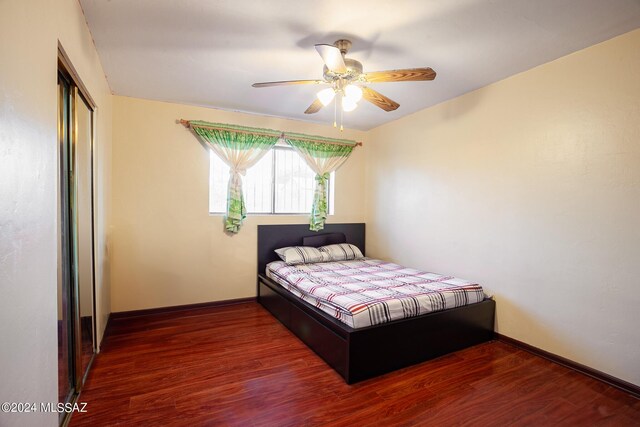 bedroom with wood-type flooring and ceiling fan