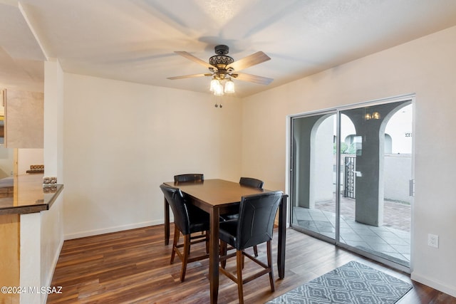 dining area with hardwood / wood-style flooring and ceiling fan