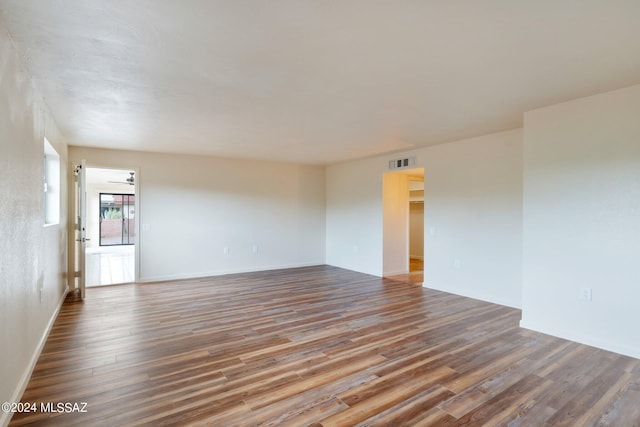 unfurnished room featuring hardwood / wood-style flooring