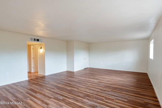 unfurnished room featuring hardwood / wood-style flooring