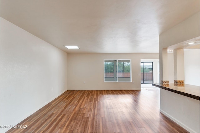 spare room with wood-type flooring