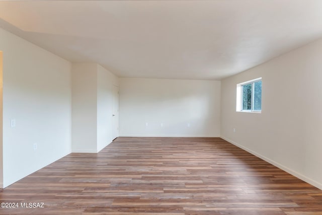 spare room featuring hardwood / wood-style floors