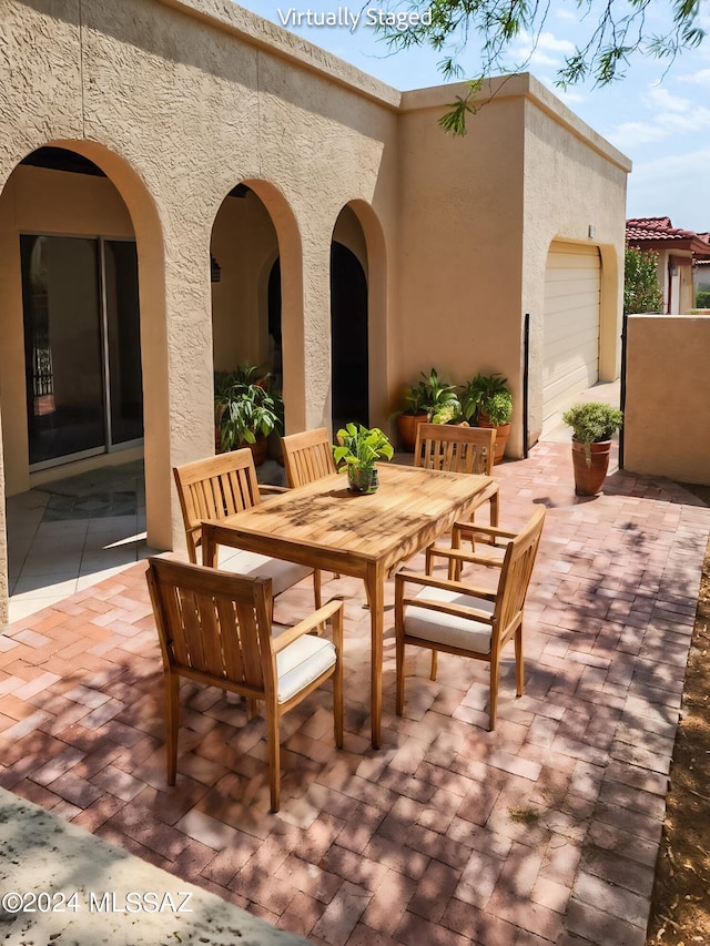 view of patio with a garage