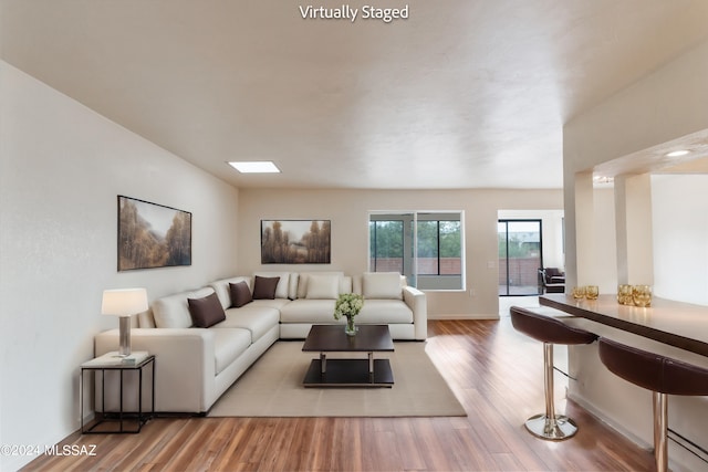 living room with hardwood / wood-style flooring