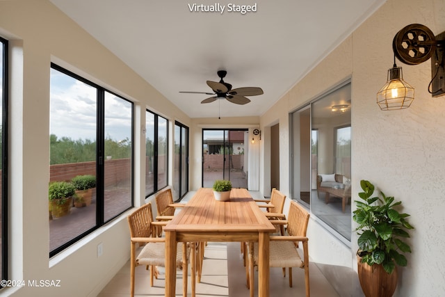 sunroom / solarium with ceiling fan