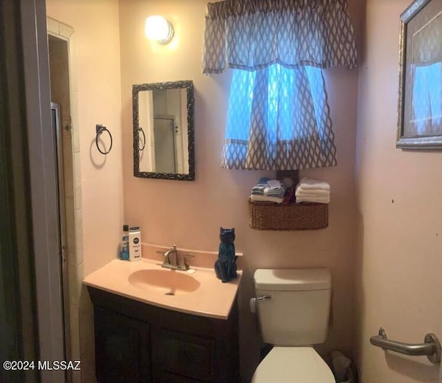 bathroom with vanity and toilet