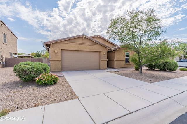 single story home with a garage