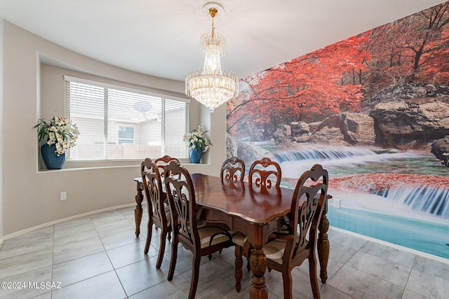 dining room with a notable chandelier and tile patterned floors