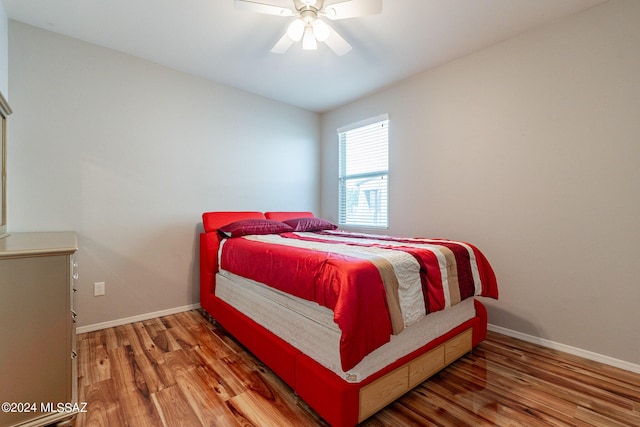 bedroom featuring wood-type flooring and ceiling fan