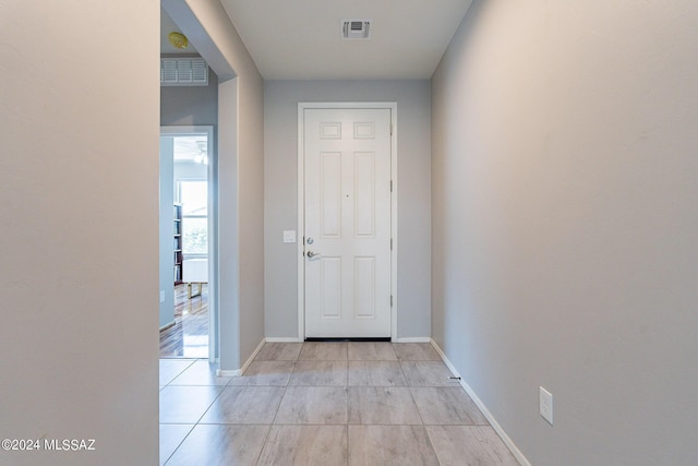 entryway featuring light tile patterned flooring