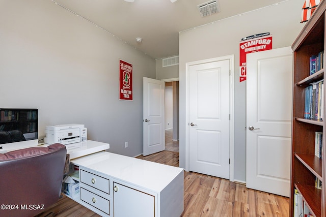 office with light hardwood / wood-style floors