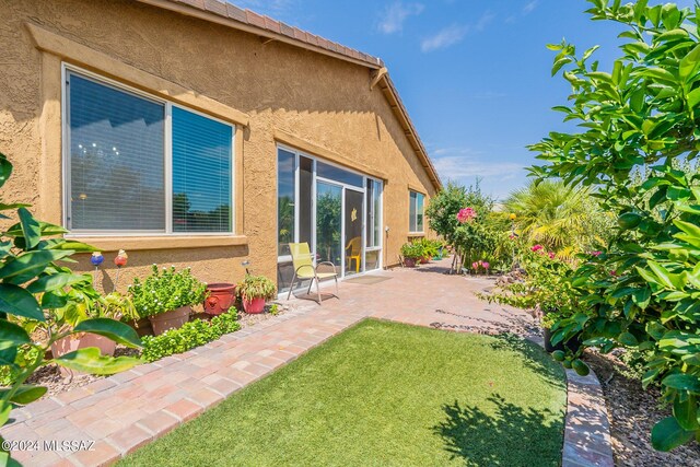 exterior space with a yard and a patio