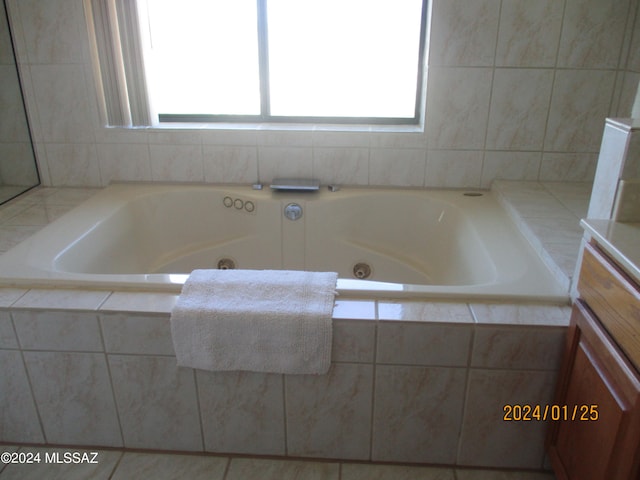 bathroom featuring a wealth of natural light and tile patterned flooring