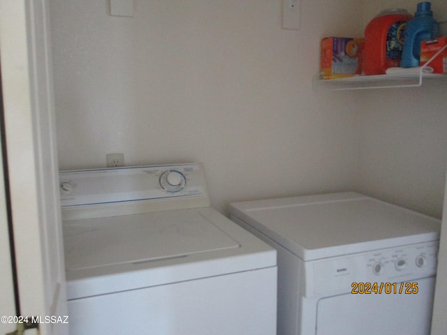 laundry room featuring separate washer and dryer