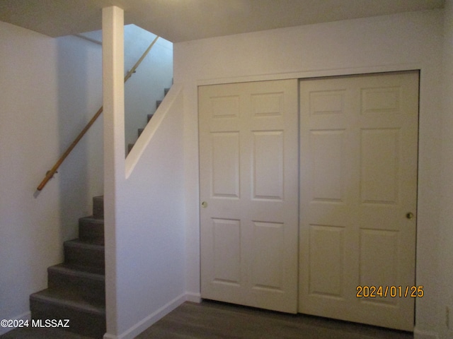 stairs featuring hardwood / wood-style flooring