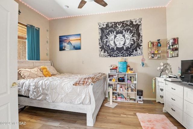 bedroom featuring light wood-type flooring and ceiling fan