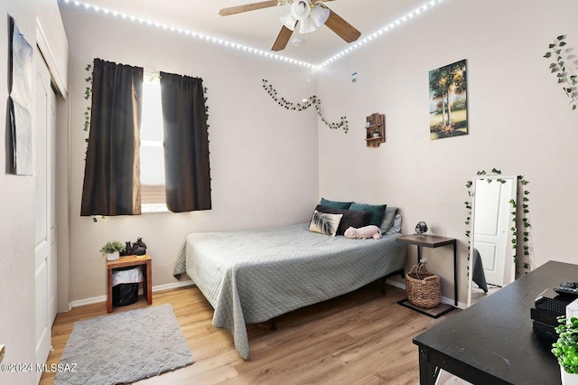 bedroom featuring ceiling fan and light hardwood / wood-style floors