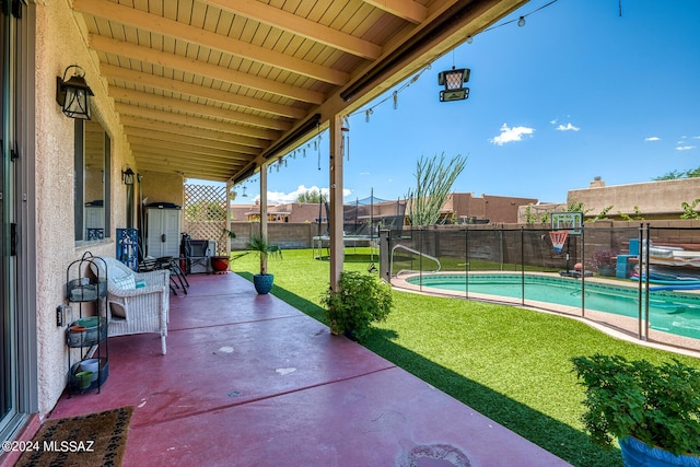 view of patio featuring a fenced in pool