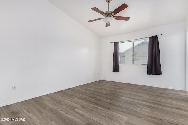 unfurnished room featuring wood-type flooring, lofted ceiling, and ceiling fan