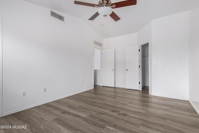 interior space featuring hardwood / wood-style flooring, a closet, high vaulted ceiling, and ceiling fan