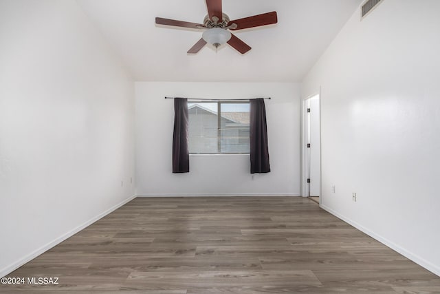 empty room featuring ceiling fan and wood-type flooring