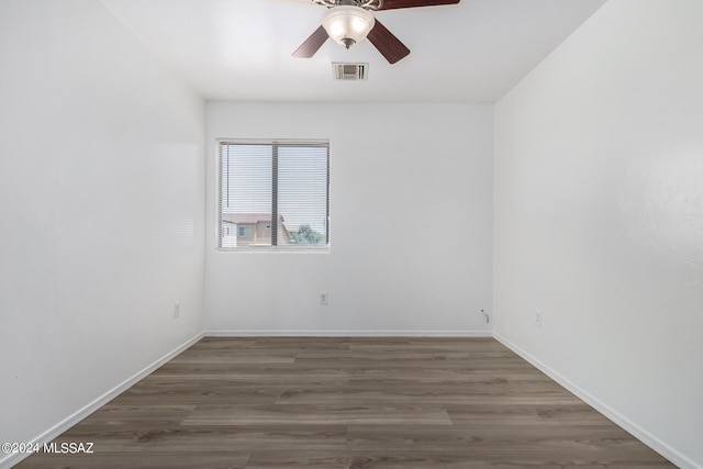 empty room with ceiling fan and hardwood / wood-style flooring