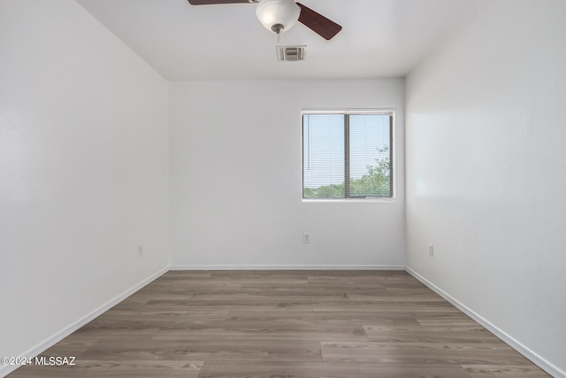 unfurnished room featuring ceiling fan and wood-type flooring