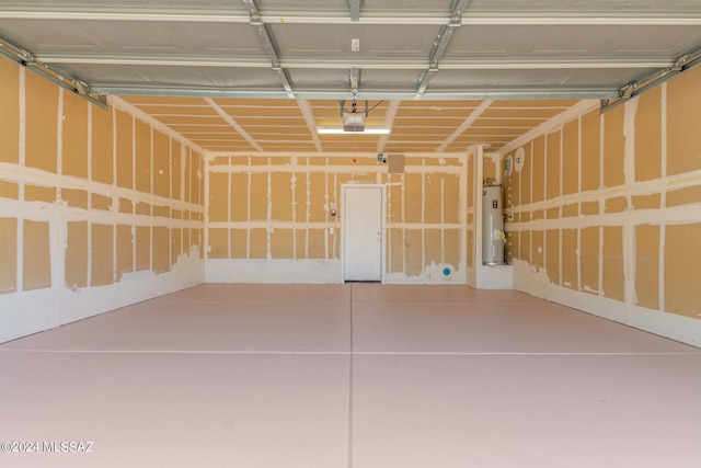 garage with a garage door opener and water heater