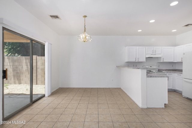 kitchen featuring white refrigerator, light tile patterned flooring, range, and white cabinets