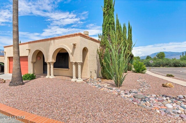 view of front of home with a mountain view