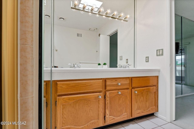 bathroom with vanity, tile patterned flooring, and visible vents