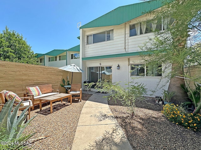 back of property featuring a patio area