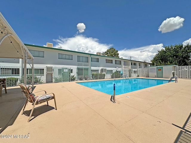 view of swimming pool featuring a patio area