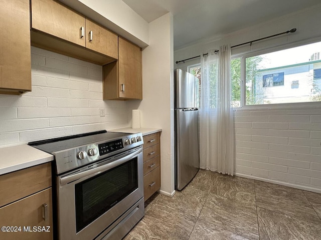 kitchen with tasteful backsplash and stainless steel appliances