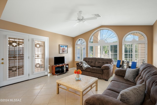 living room featuring lofted ceiling, visible vents, ceiling fan, and light tile patterned floors