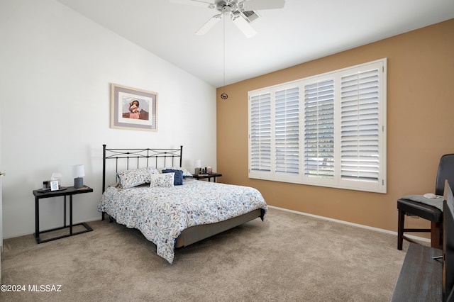 bedroom with a ceiling fan, lofted ceiling, light colored carpet, and baseboards