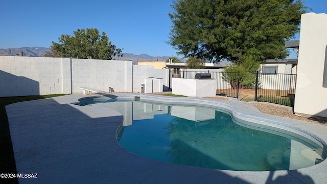 view of swimming pool featuring a mountain view