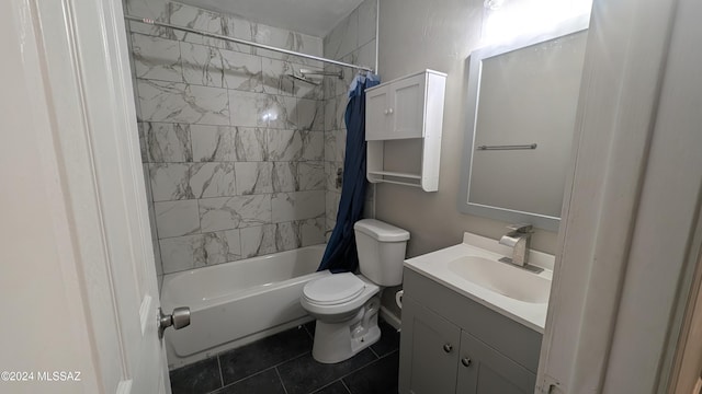 full bathroom featuring vanity, toilet, tile patterned flooring, and shower / tub combo