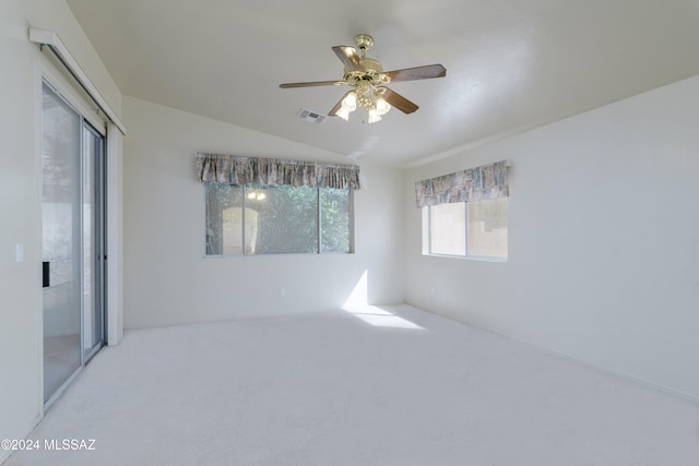 spare room with ceiling fan, carpet floors, and lofted ceiling