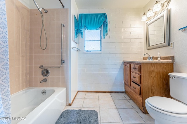 full bathroom featuring brick wall, tiled shower / bath combo, vanity, toilet, and tile patterned floors