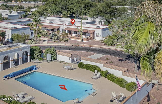 view of swimming pool featuring a patio area