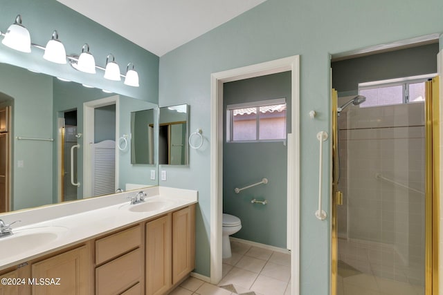 bathroom featuring toilet, an enclosed shower, a wealth of natural light, and tile patterned flooring