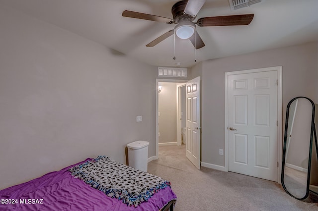 bedroom with light colored carpet and ceiling fan