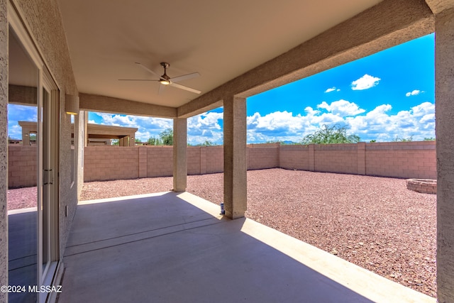 view of patio featuring ceiling fan